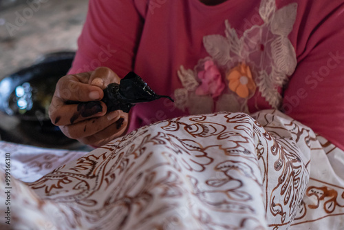 The process of making written batik uses canting to make lines and the dots on the fabric.