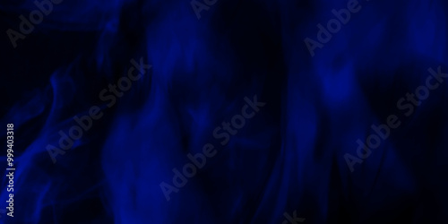 Blue smoke in dark background.Texture and desktop picture. blue texture with colorful smoke, decorative and blurry fire motion one line, minimalistic art textures for making flyer and poster design. 