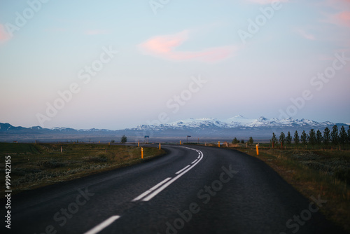 Scenic highway with mountain in the background in Iceland