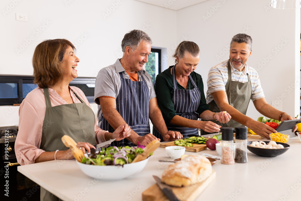 Cooking together, senior diverse friends preparing healthy meal in modern kitchen, at home Cooking together, senior diverse friends preparing healthy meal in modern kitchen, at home