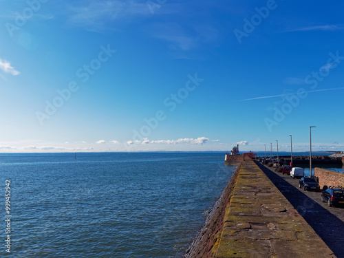 Wallpaper Mural The traditional stone Breakwater of Arbroath East Pier with the Harbour Lighthouse in the distance at the Harbour Entrance. Torontodigital.ca