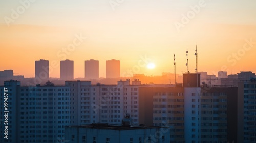 A breathtaking sunrise over city buildings, casting a warm glow across the skyline. Perfect for urban and nature-themed projects.