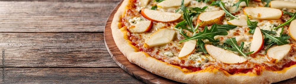 Delicious apple pizza topped with fresh arugula on a wooden table, perfect for gourmet lovers and culinary enthusiasts.
