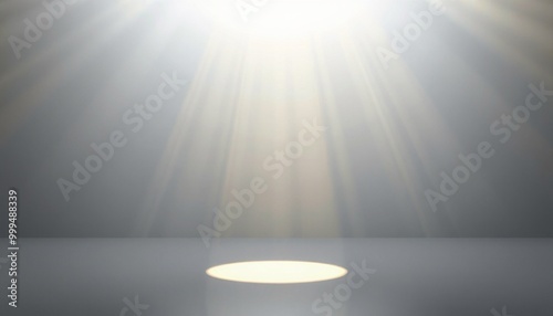 Gray studio background with a spotlight and light rays.