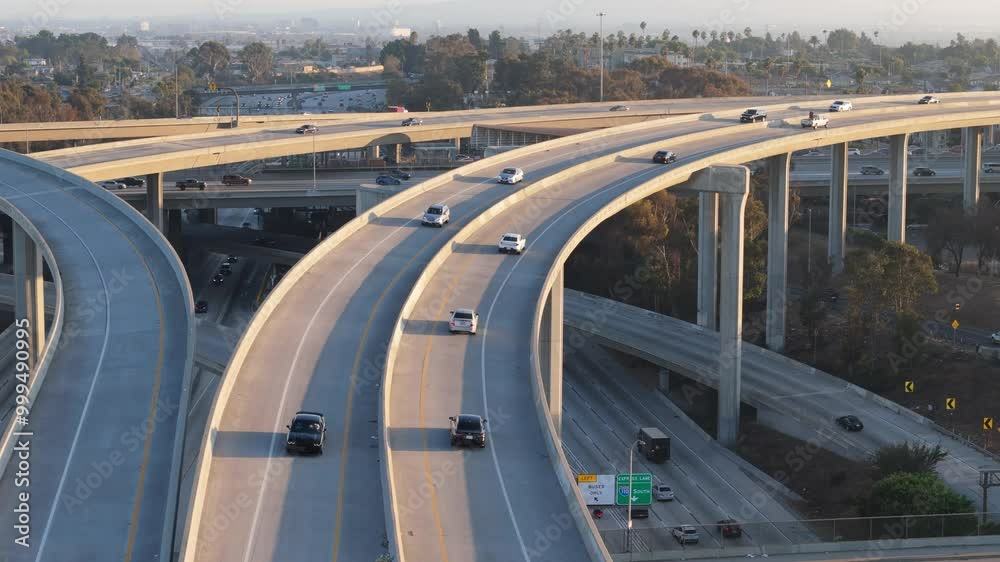 Closeup arial shot of cars dryving on complex highway intersection. Los Angees. Sunset. 4k. Drone. Closeup arial shot of cars dryving on complex highway intersection. Los Angees. Sunset. 4k. Drone.