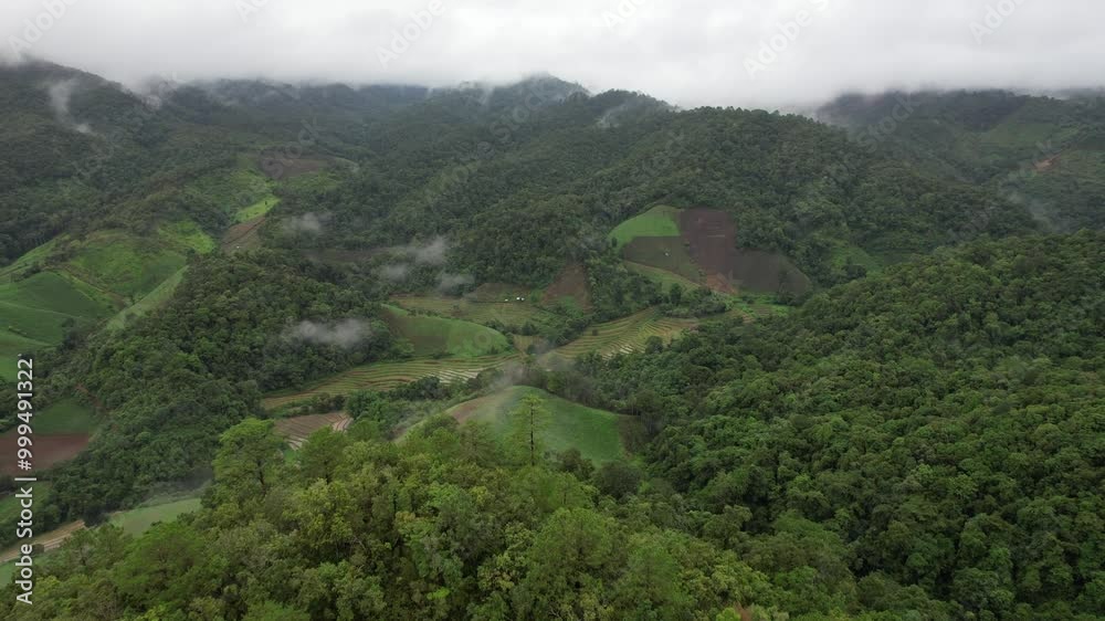 Aerial view of mountains and rice terraces field in northern of Thailand by drone Aerial view of mountains and rice terraces field in northern of Thailand by drone