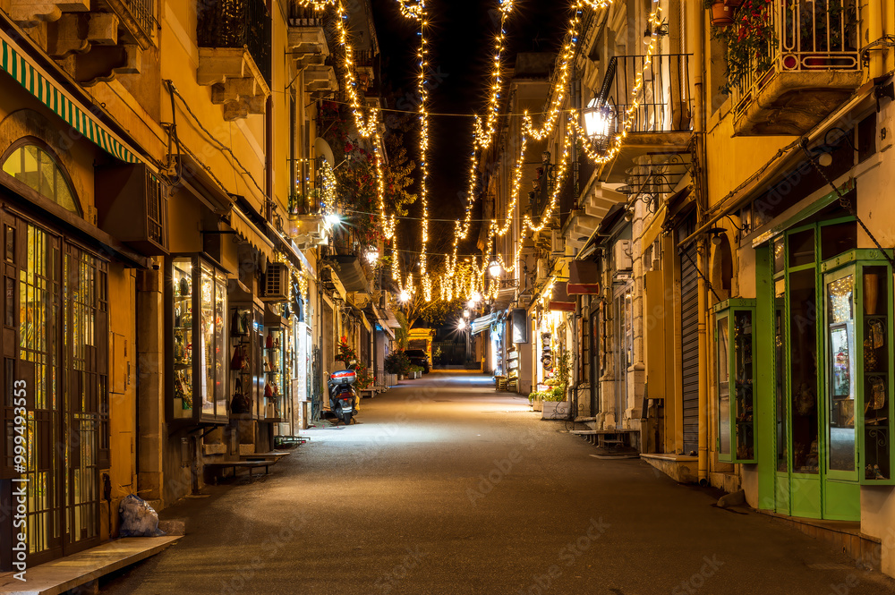 beautiful Christmas holiday street with decorated buildings and bright garlands in a New Year city beautiful Christmas holiday street with decorated buildings and bright garlands in a New Year city