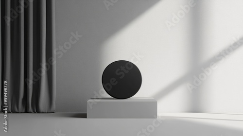 Black 3D object positioned against a soft grey wall backdrop