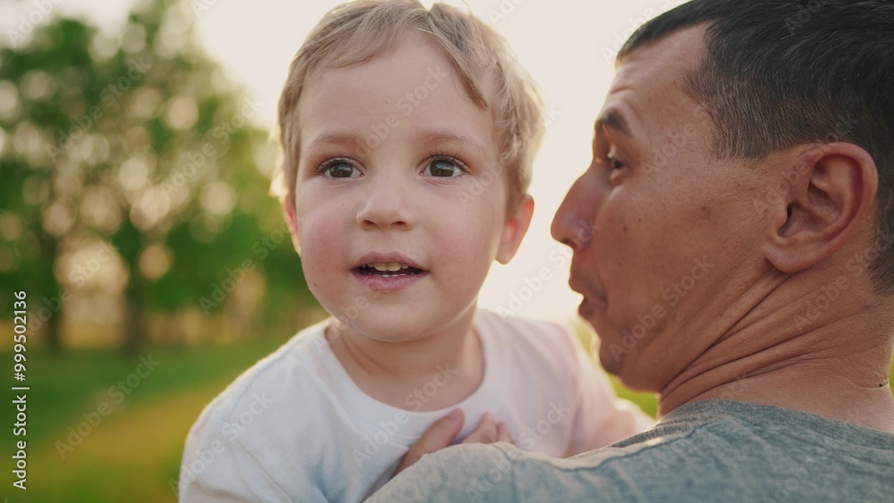 son hugging dad in the park. happy family a father day kid dream concept lifestyle. baby boy walking with dad in nature in his arms. baby hugging dad in the park son hugging dad in the park. happy family a father day kid dream concept lifestyle. baby boy walking with dad in nature in his arms. baby hugging dad in the park