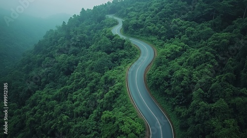 Aerial View of Winding Asphalt Road ,perfect for illustrating travel, adventure, and the connectivity of rural and urban areas