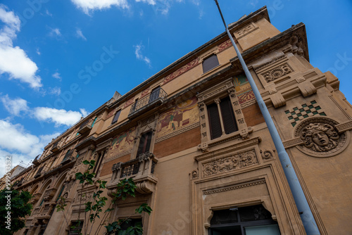 Messina, Italy - Urban Architecture in Messina with Mythological Decor: A Carved Medusa Gorgon on the Facade of a City Building. Botton to top view.