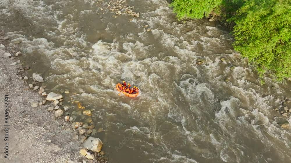 Aerial view of white water rafting on a tropical rainforest river Aerial view of white water rafting on a tropical rainforest river