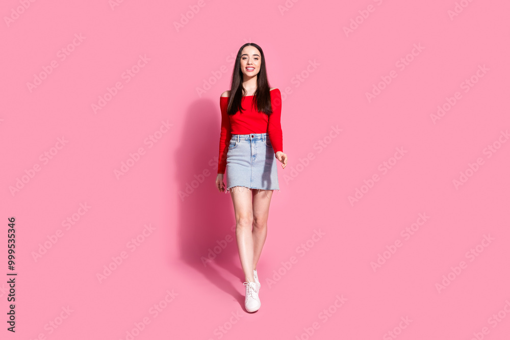 Full body portrait of pretty young girl walk empty space ad isolated on pink color background Full body portrait of pretty young girl walk empty space ad isolated on pink color background