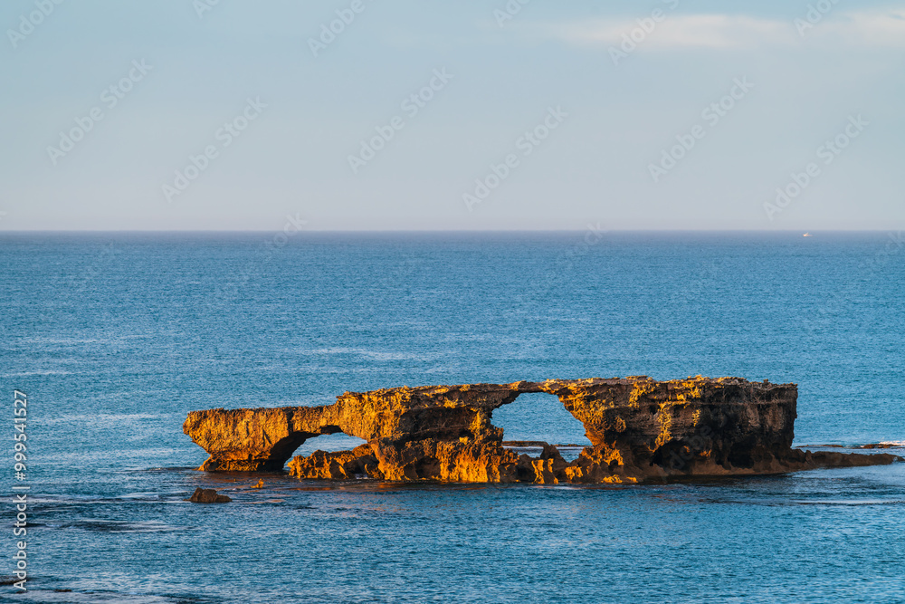The Doorway Rock in Robe during sunrise, Cape Dombey, Limestone Coast, South Australia The Doorway Rock in Robe during sunrise, Cape Dombey, Limestone Coast, South Australia