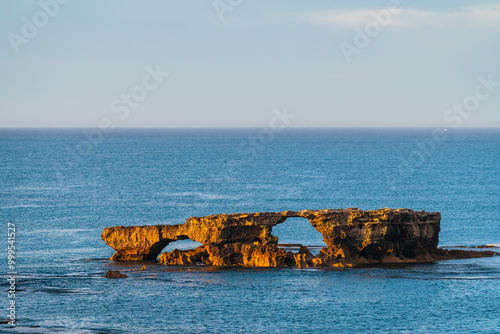 The Doorway Rock in Robe during sunrise, Cape Dombey, Limestone Coast, South Australia photo