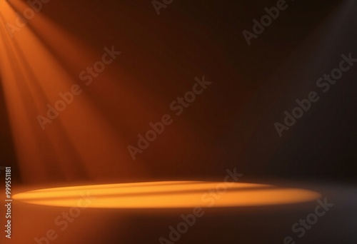 Orange spotlight shining on a dark surface. photo