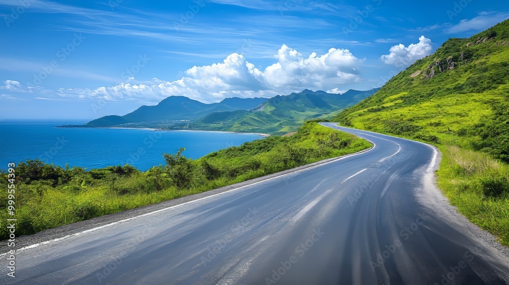 Naklejka premium Asphalt road and green mountain with sea natural landscape under blue sky
