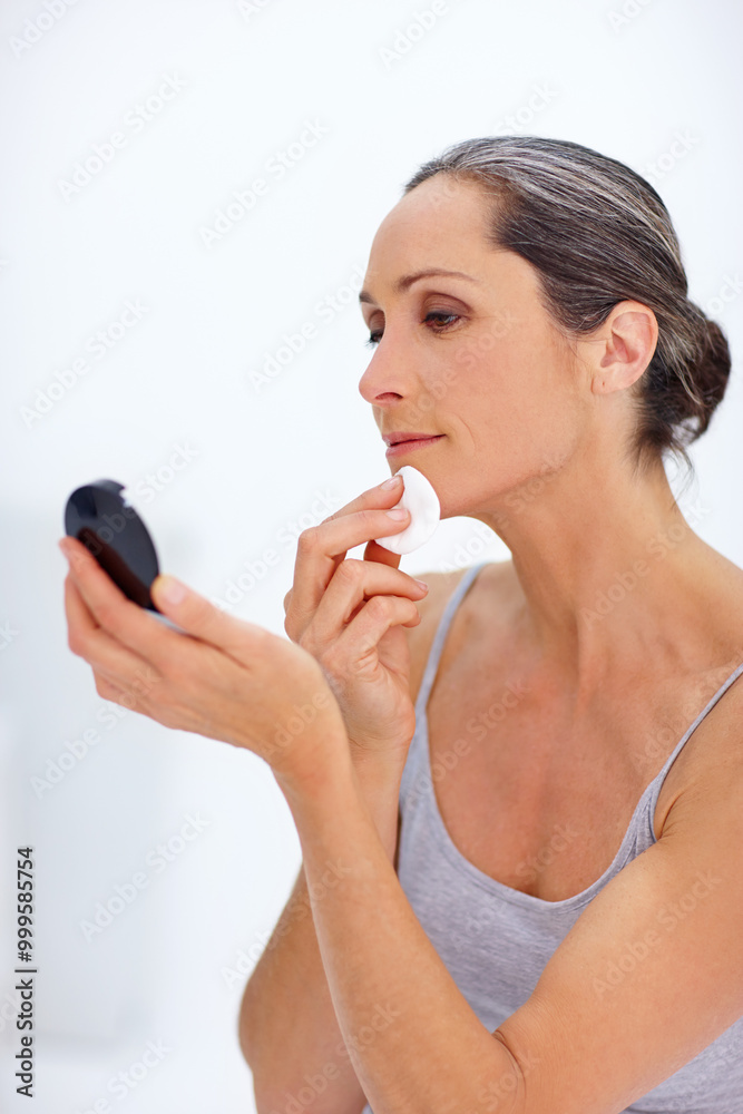 Mature woman, skincare and cotton pad as makeup removal for beauty routine in bathroom. Female person, mirror and foundation cleaning with clear skin, glow and cleanser for self care and grooming Mature woman, skincare and cotton pad as makeup removal for beauty routine in bathroom. Female person, mirror and foundation cleaning with clear skin, glow and cleanser for self care and grooming