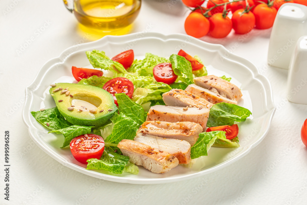 Fresh mix salad of avocado, tomato, grilled chicken salad. Fit Bowl. Healthy keto lunch menu. Top view Fresh mix salad of avocado, tomato, grilled chicken salad. Fit Bowl. Healthy keto lunch menu. Top view