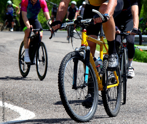 cyclists with gravel bikes during competitive mixed terrain cycling race