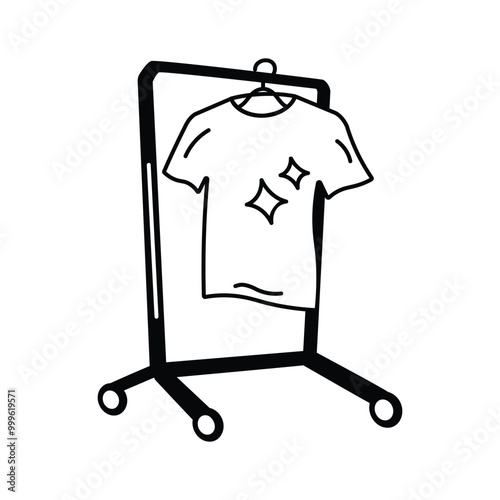 A standing clothes rack holding a clean shirt for drying