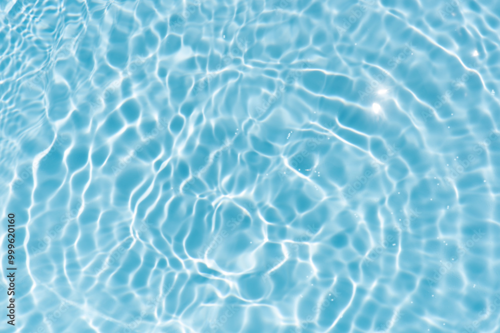 Blue water with ripples on the surface. Defocus blurred transparent blue colored clear calm water surface texture with splashes and bubbles. Water waves with shining pattern texture background. Blue water with ripples on the surface. Defocus blurred transparent blue colored clear calm water surface texture with splashes and bubbles. Water waves with shining pattern texture background.