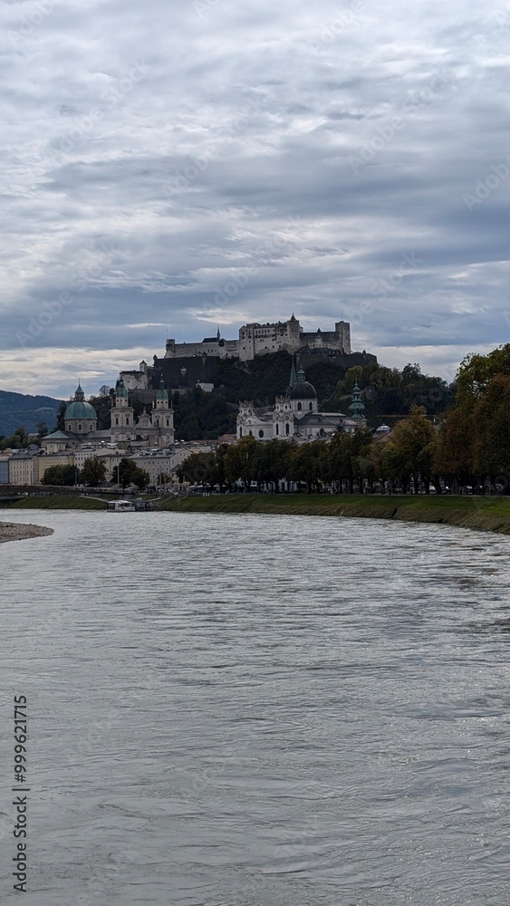 Naklejka premium Castle Hohensalzburg in the city Salzburg, view over the river, city landscape