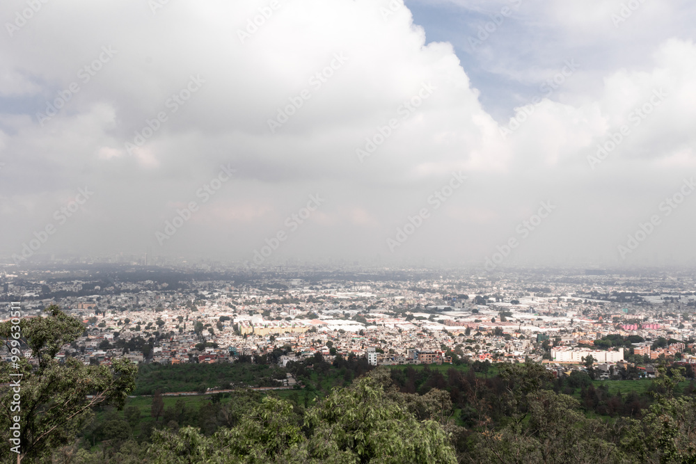 Expansive view over a bustling Mexican city from hilltop Expansive view over a bustling Mexican city from hilltop