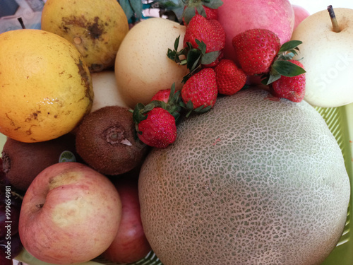 various types of fresh fruit in a basket photo