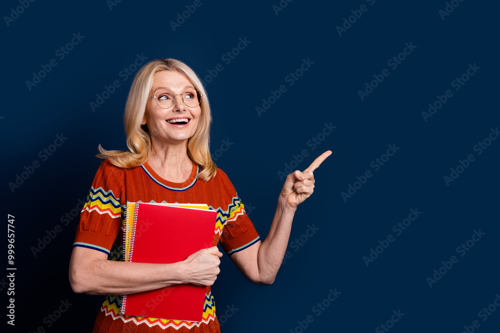 Photo of cheerful lovely nice woman wear trendy clothes recommend empty space isolated on dark blue color background Photo of cheerful lovely nice woman wear trendy clothes recommend empty space isolated on dark blue color background