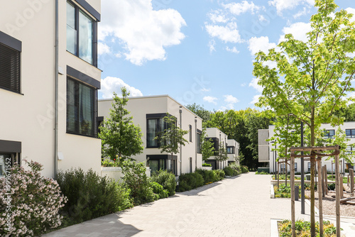 Residential area with ecological and sustainable green residential buildings, low-energy houses with apartments and green courtyard