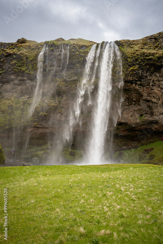 Seljalandsfoss waterfall is being blown away by the strong wind, Iceland 