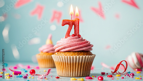 Birthday cupcake with burning lit candle with number 71. Number seventy-one for seventy-one years or seventy-first anniversary. photo