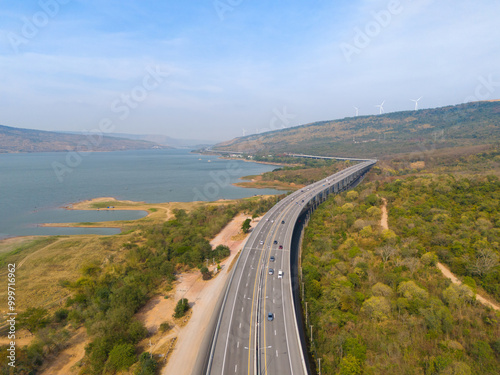 The M6  motorway Expressway Nakhon Ratchasima Province - Bang Pa-in. Lam Ta Khong River and Mountain. Drone shot of scenic landscape rural place traffic. Nakhon Ratchasima Thailand. Motorway Korat photo