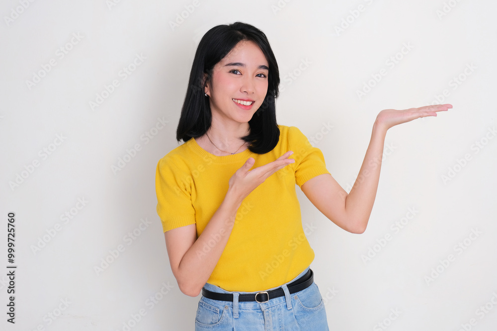 A women smiling at the camera with her left hand lift something A women smiling at the camera with her left hand lift something