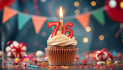 Birthday cupcake with burning lit candle with number 76. Number seventy-six for seventy-six years or seventy-sixth anniversary. photo