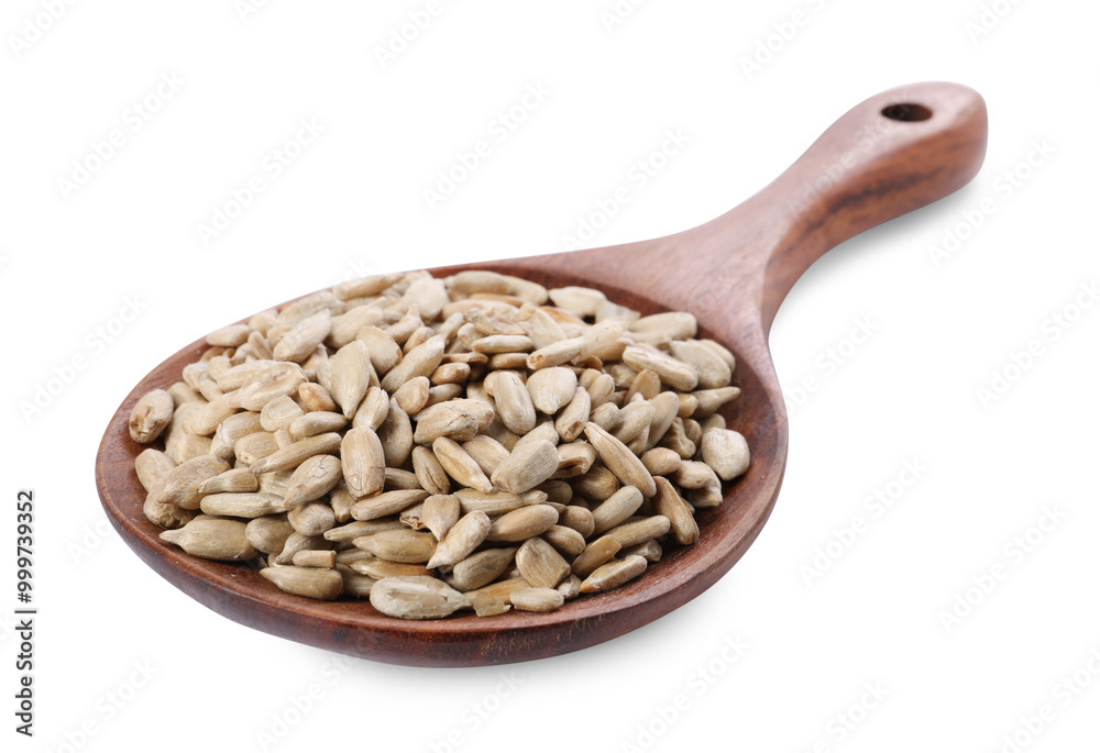 Peeled sunflower seeds in wooden spoon isolated on white Peeled sunflower seeds in wooden spoon isolated on white