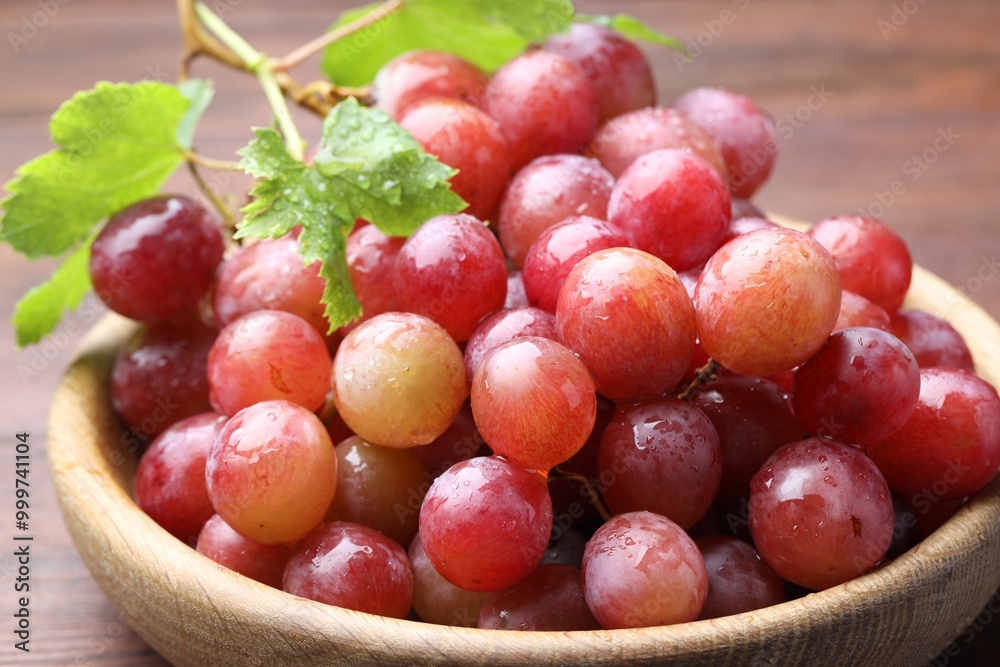 Fresh ripe grapes on wooden table, closeup Fresh ripe grapes on wooden table, closeup