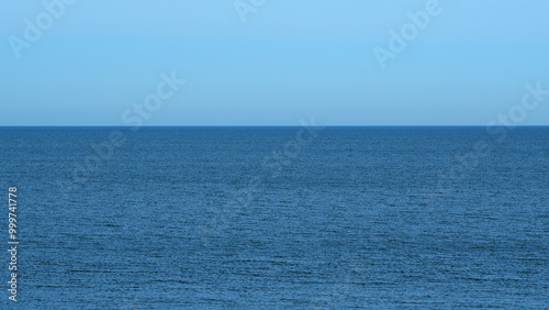 Wavy Sea With Horizon At A Blue Sky. Calming Waves Of The Sea Or Ocean. Sunny Summer Day. Real time.