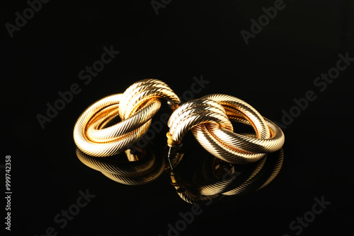 Cuadro en lienzo Beautiful bijouterie. Stylish earrings on black background