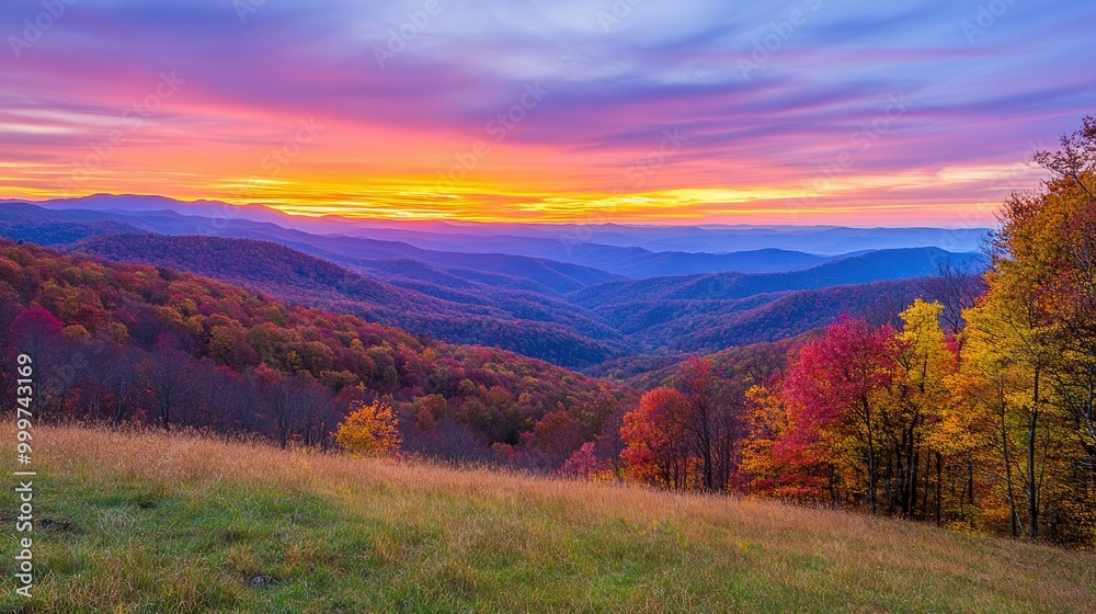 A vibrant sunset over rolling hills adorned with autumn foliage. A vibrant sunset over rolling hills adorned with autumn foliage.
