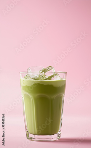  glass of matcha latte with ice cubes, full view, light pink background, food photography, front shot, soft lighting, minimalist style, fresh tones