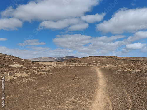 Arid landscape of Costa Teguise with mountains and volcanoes Lanzarote Spain