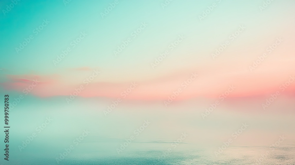 Obraz premium A serene landscape featuring soft pastel colors blending into a misty horizon over water.