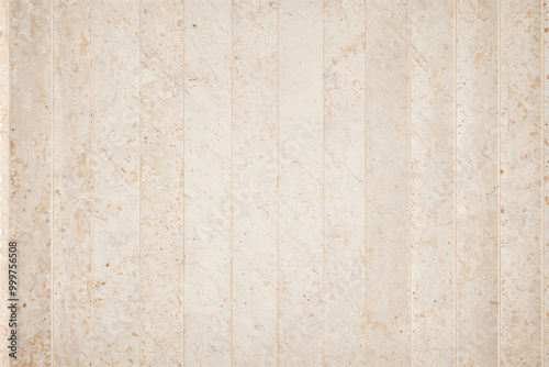 A pale pink wallpaper with a floral design in gold
