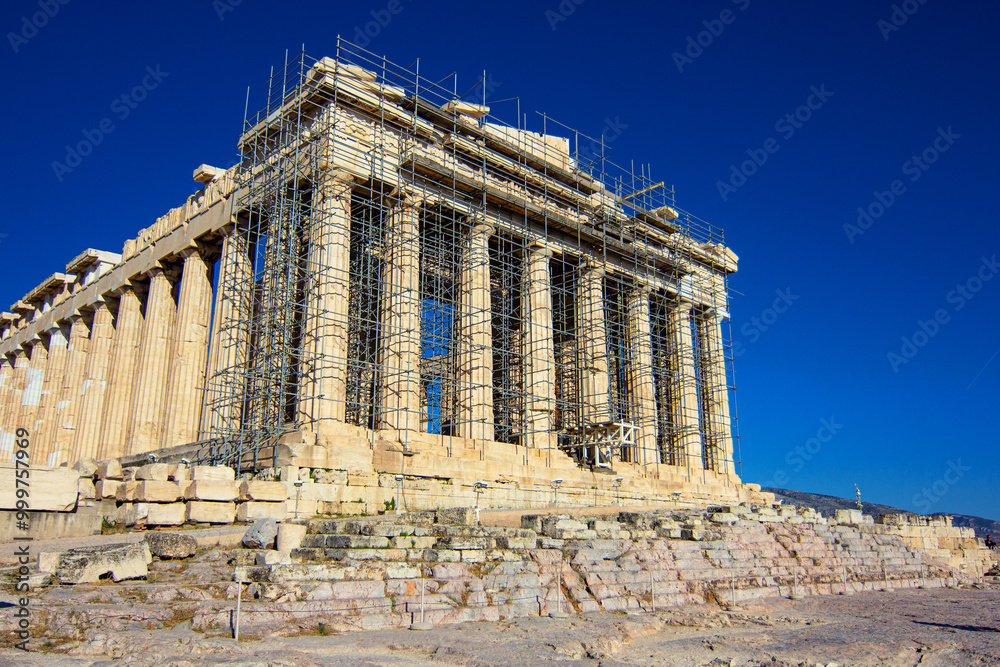 Obraz premium Parthenon temple is an ancient greek temple on the Athenian Acropolis, Greece, that was dedicated to the goddess Athena.