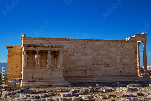 Erechtheion temple with Maiden porch. This is ancient Ionic temple on the north side of Acropolis in Athens. Columns of the portico of the Caryatids were made of Pentelic marble photo