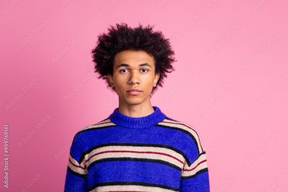 Photo of confident mixed race man guy with wavy hairstyle dressed knitwear sweater look at camera isolated on pink color background Photo of confident mixed race man guy with wavy hairstyle dressed knitwear sweater look at camera isolated on pink color background