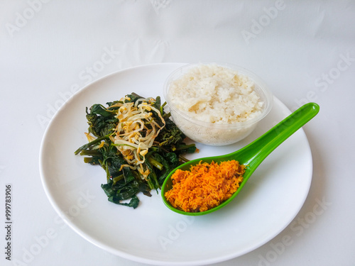 Urap Sayur. healthy and traditional indonesian food isolated on white photo