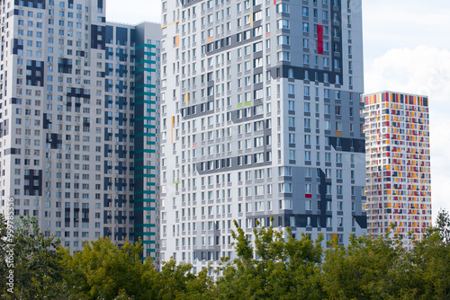 A modern residential quarter with fashionable bright houses. Real estate, new buildings photo